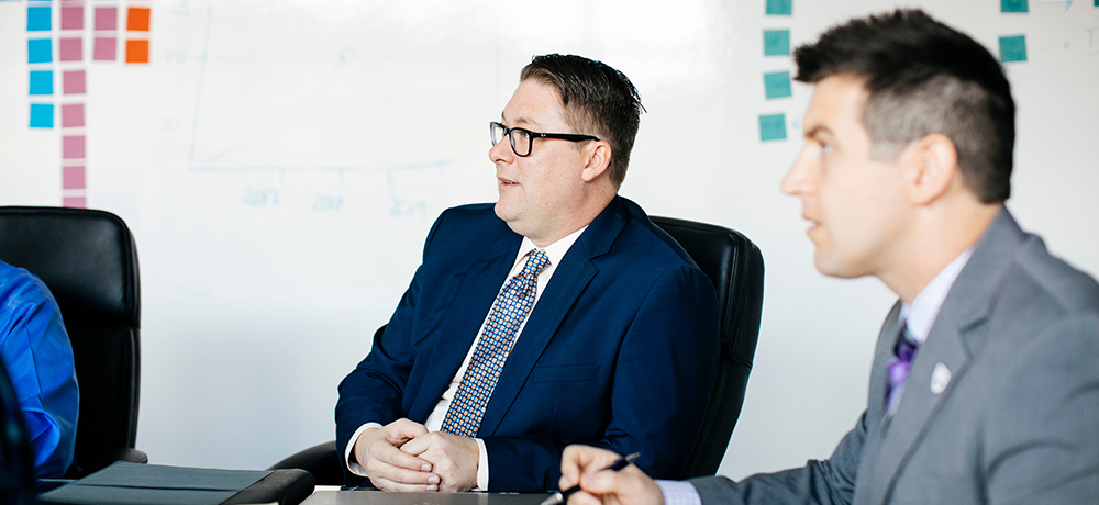 MBA_groupboardroom_hero.jpg group in boardroom