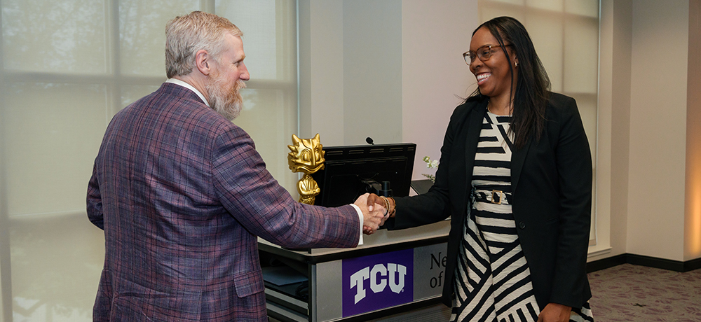 Dean Crossland shaking Michelle Franklin's hand