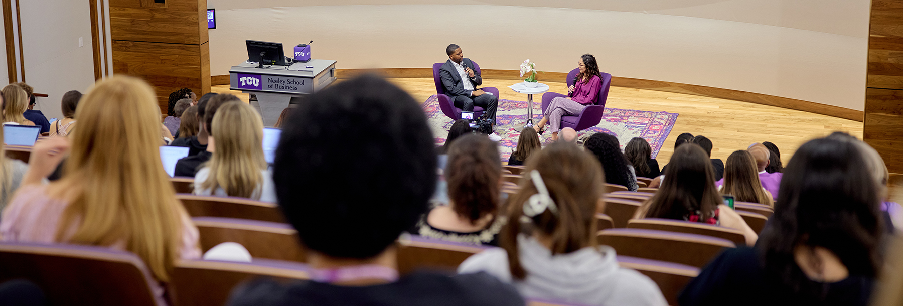 Section Image: David Russell and Jennifer Trevino on stage in the Shaddock Auditorium 