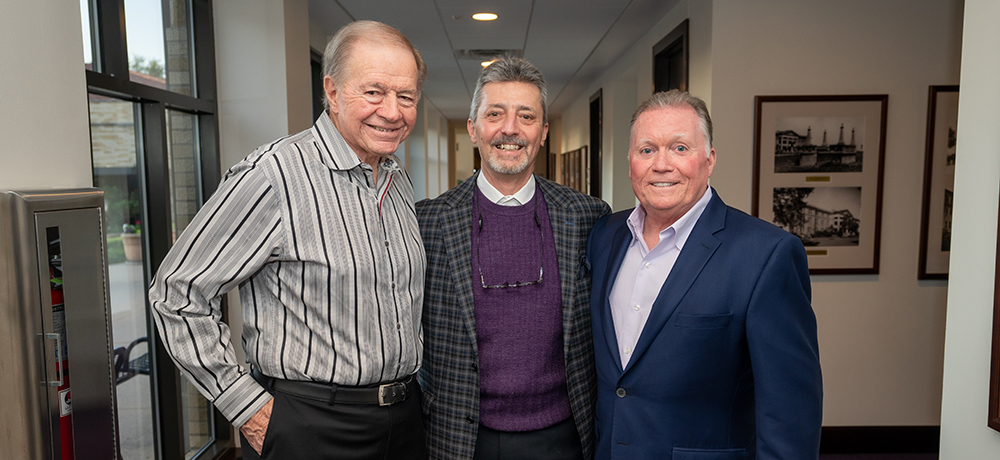 Ed Riefenstahl with two others in the business school