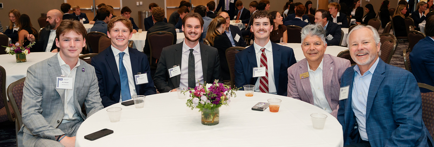 Section Image: Group of students and mentors at the table in the BLUU ballroom 