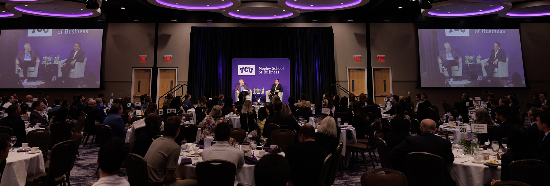 Section Image: Jim Keyes and Craig Crossland on the stage in the BLUU ballroom 