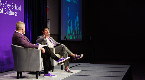 Craig Crossland and Daniel Pullin sitting on stage 