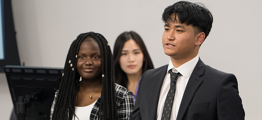 Students presenting in front of a class
