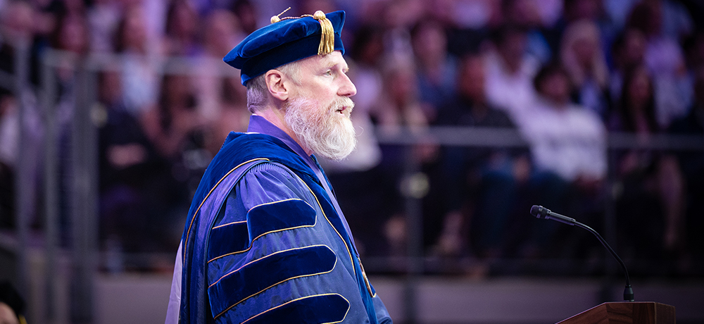 Craig Crossland in regalia addressing Convocation
