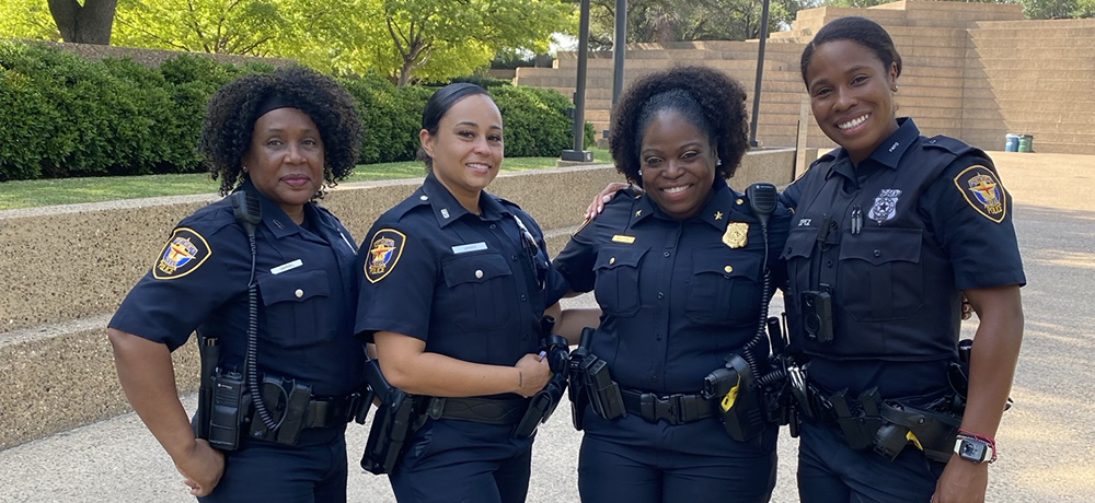 Monica with fellow female police officers by the Fort Worth Water Gardens