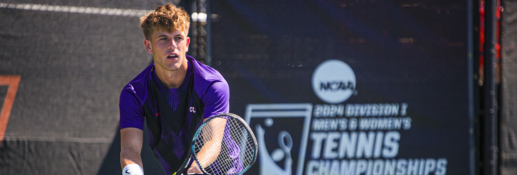 Section Image: Luke Swan serving during a tennis match 